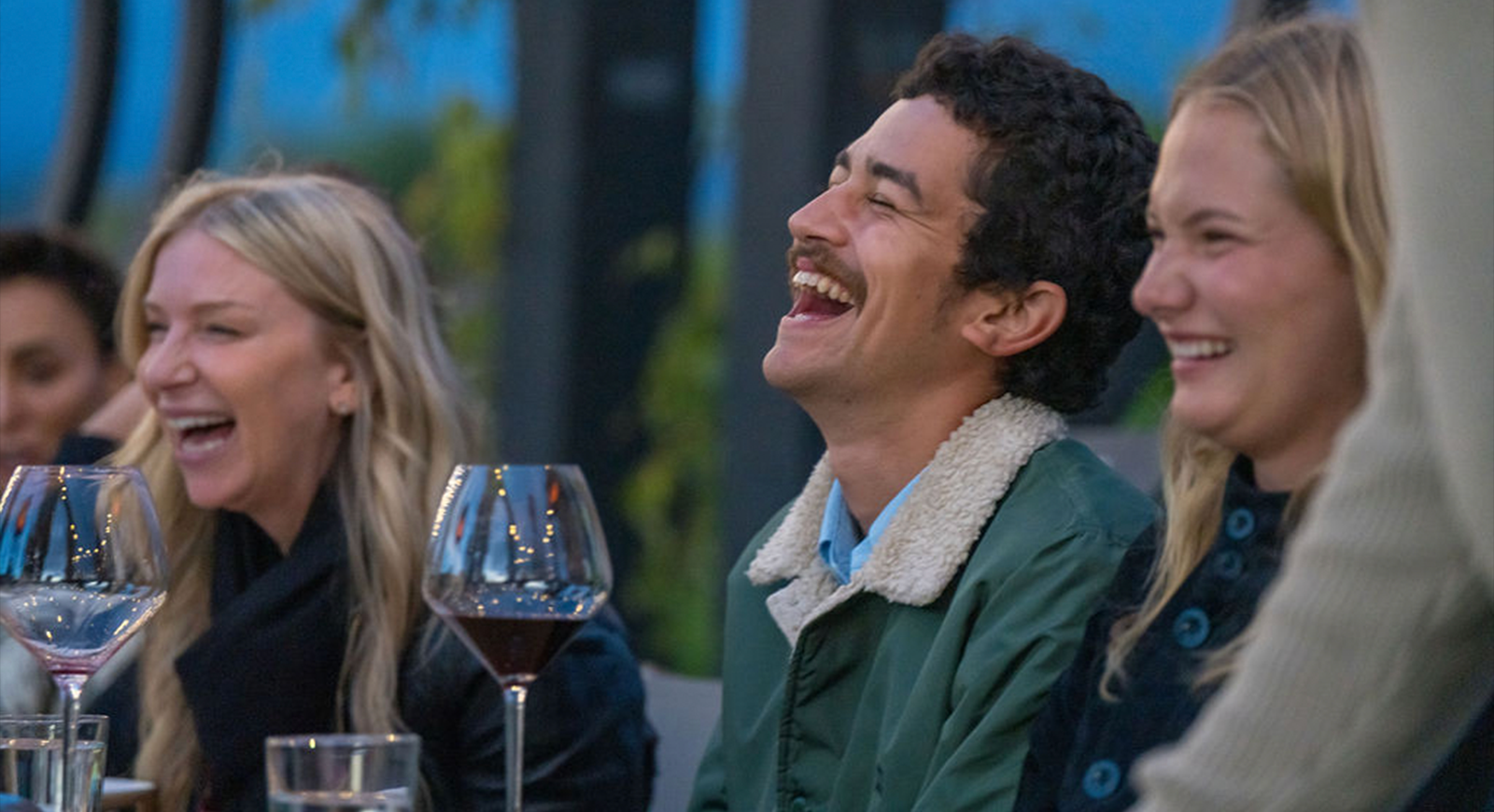 Photo of guests laughing and enjoying their meal in the Grange.