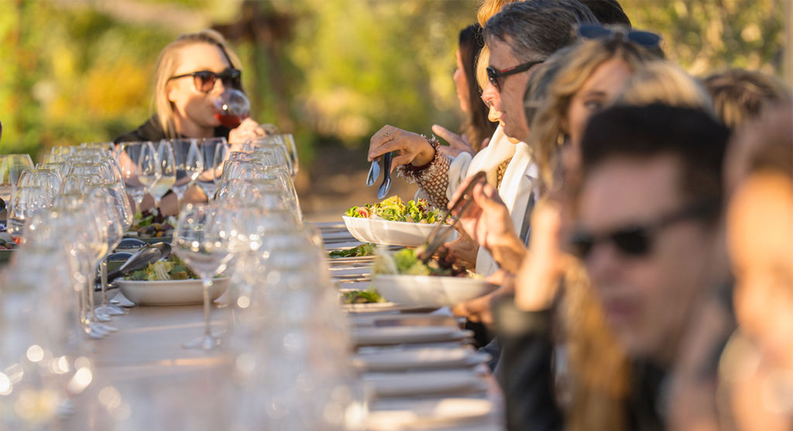 Photo of guests enjoying the meal during the golden hour.