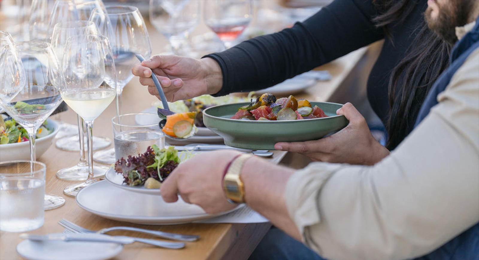 Photo of guests plating the tomato salad.