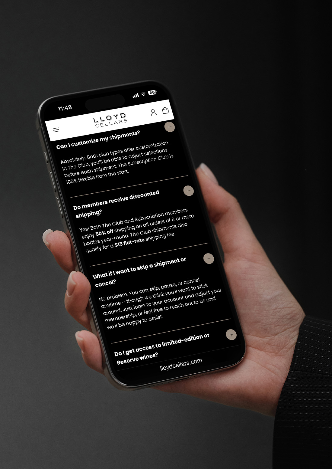 Hand holding a smartphone with the Lloyd Cellars wine club FAQ interface visible, highlighting customization and membership benefits.