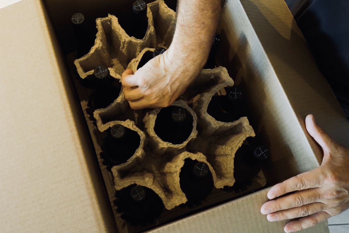 Recyclable molded fiber wine packaging insert with Lloyd Cellars eco-friendly shipping card