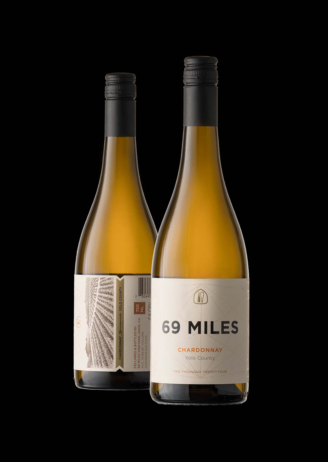 69 Miles Chardonnay bottles from Yolo County photographed on a black background.