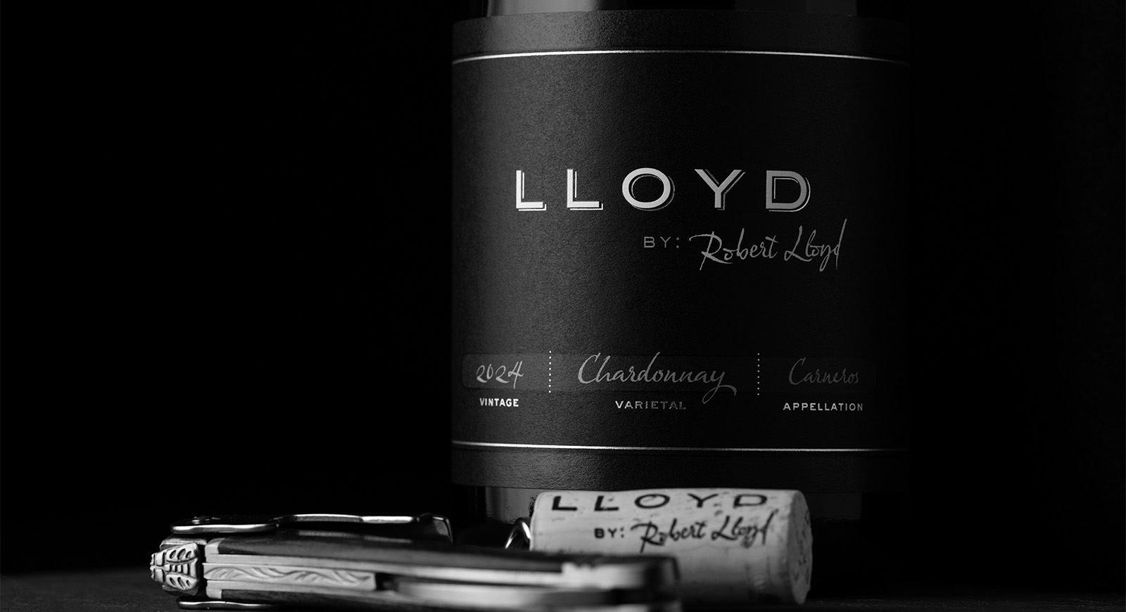 Lloyd by Robert Lloyd 2024 Chardonnay, Carneros, bottle and cork in black and white